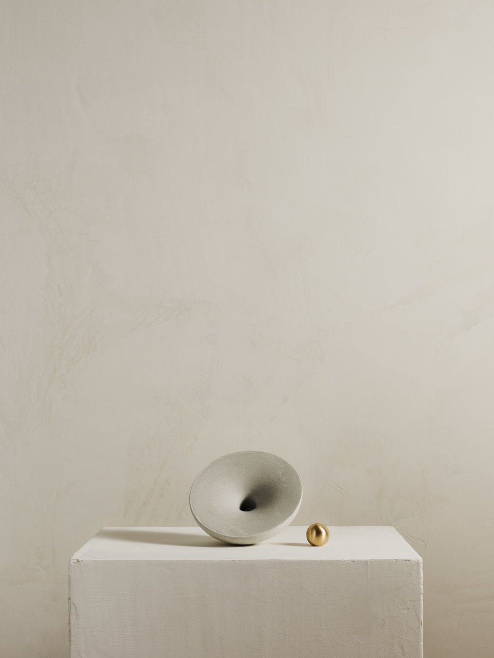 Incense burner consisting of concrete vortex and brass ball 