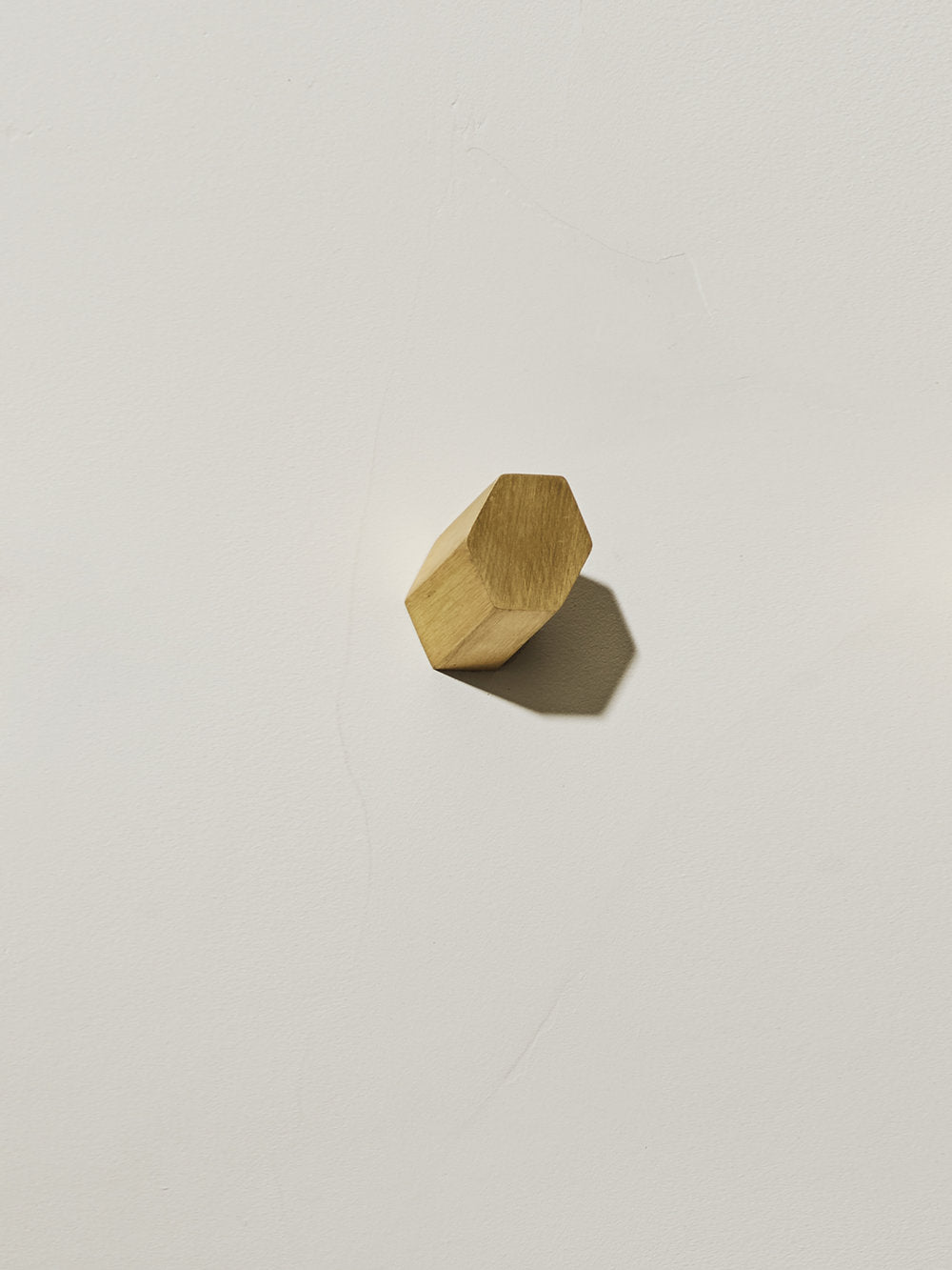 single brushed brass hexagonal parallax wall hook