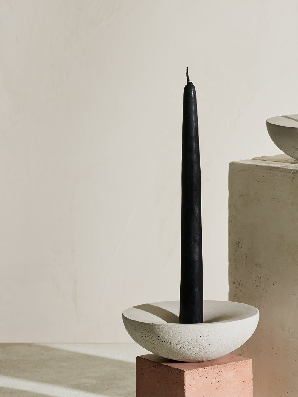 Concrete Vorta being used candle stick holder
