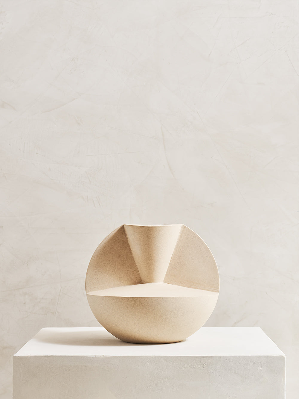 Geometric stoneware vase on pedestal