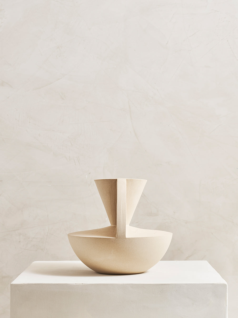 Geometric stoneware vase on pedestal